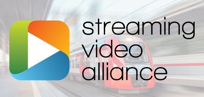 Logo of Streaming Video Alliance superimposed over image of a train at a train station
